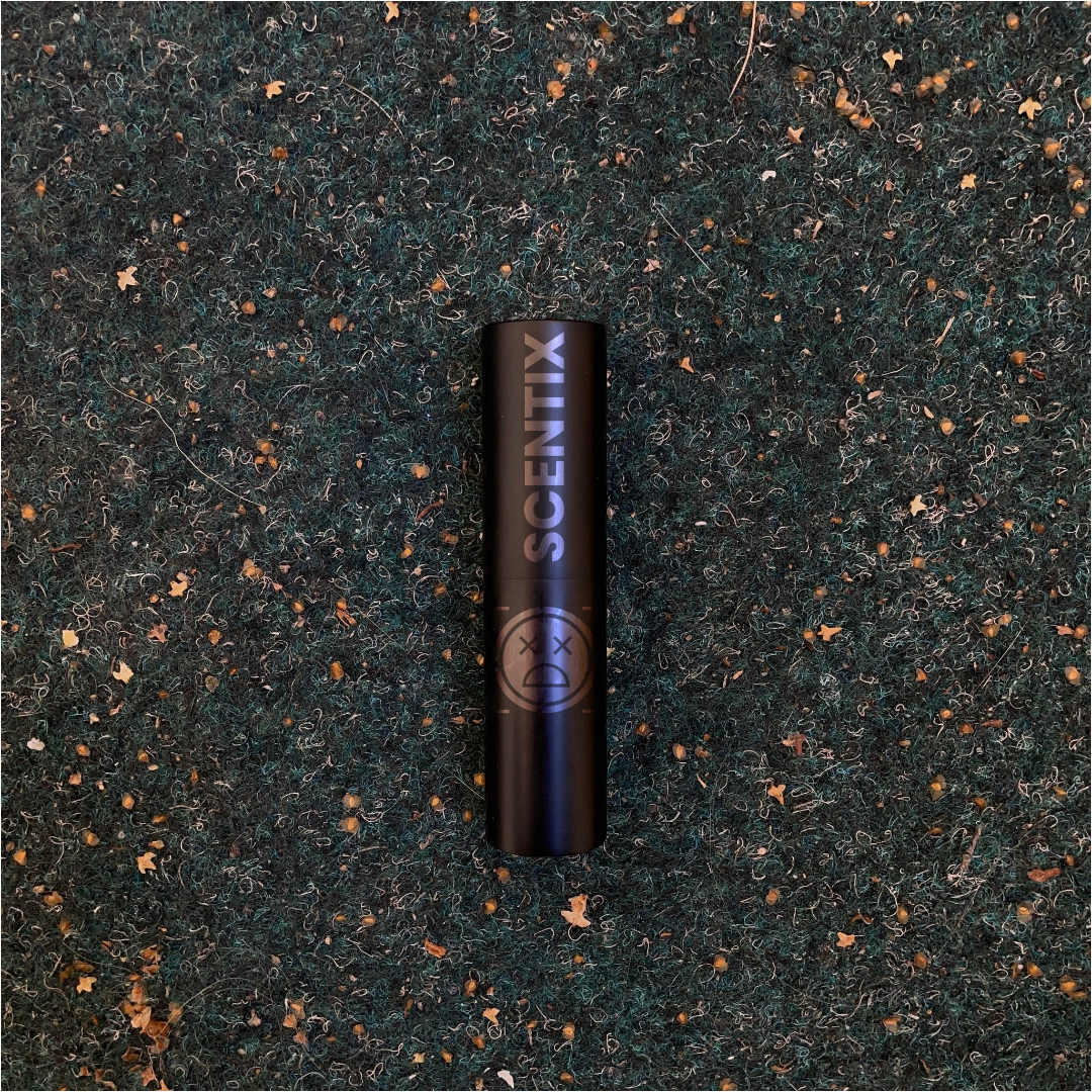 A product photo of a black atomizer case with the text scentix engraved on it.